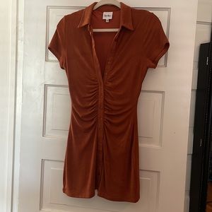 Button front dress with center ruching in fun terracotta color!